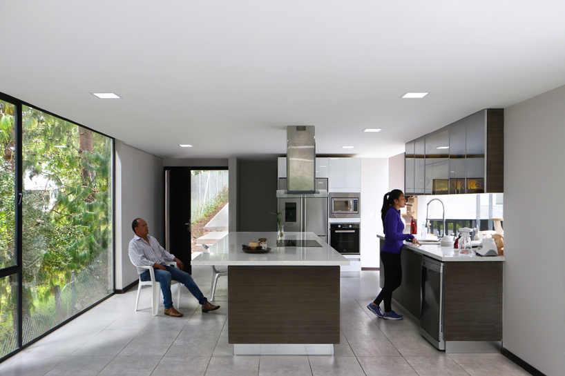 ruptura morlaca's concrete house floats weightlessly over serene landscape in ecuador