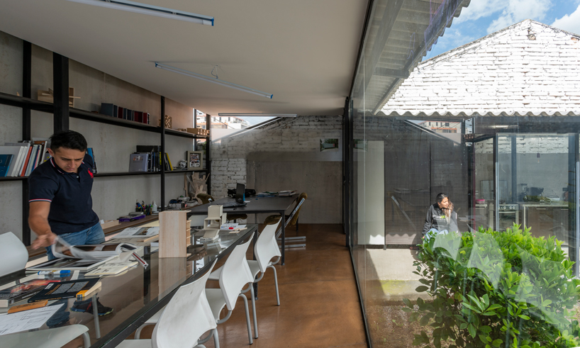 ruptura morlaca plans a glazed workshop around a central courtyard in ecuador designboom