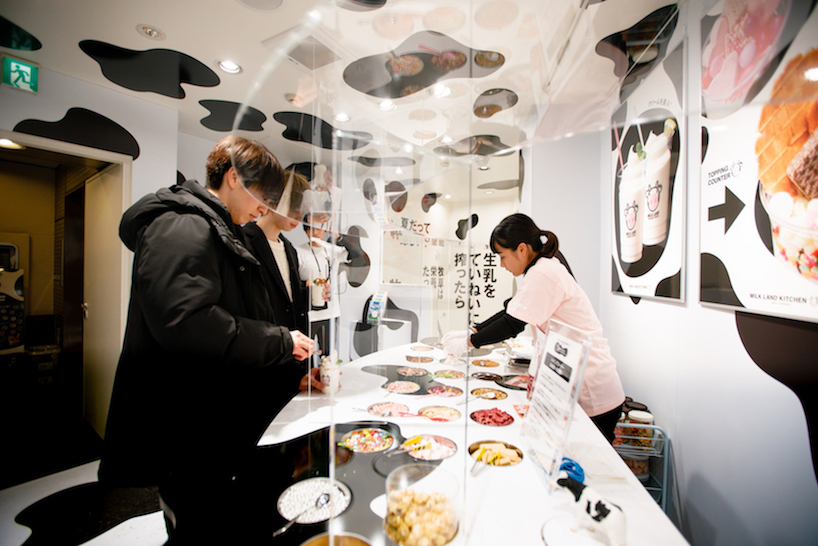 ryusuke&nbsp;nanki covers pop up store 'milk land' in shibuya in cow pattern