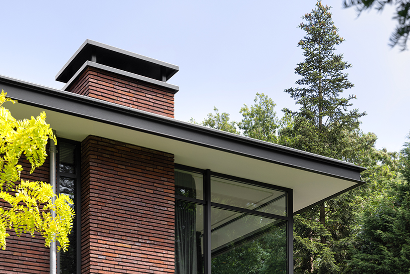 red brick facade and steel fascias form villa trompenberg in the netherlands