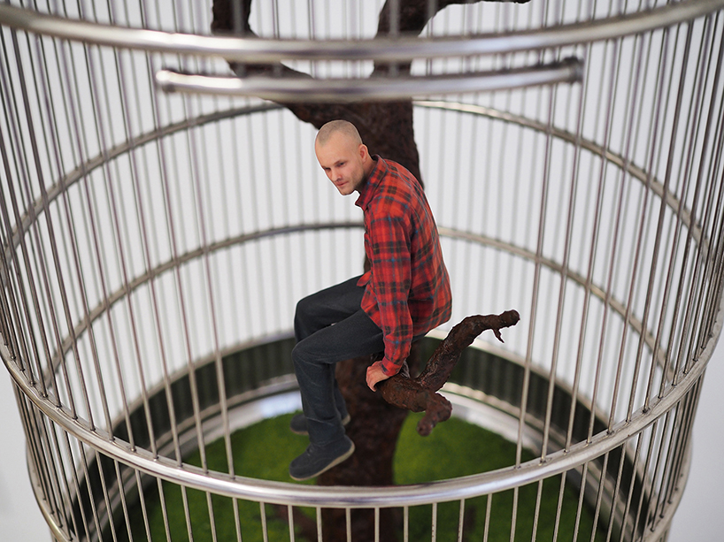 artist imprisons 3D printed 'mini-me' in birdcage to question contemporary ways of living designboom