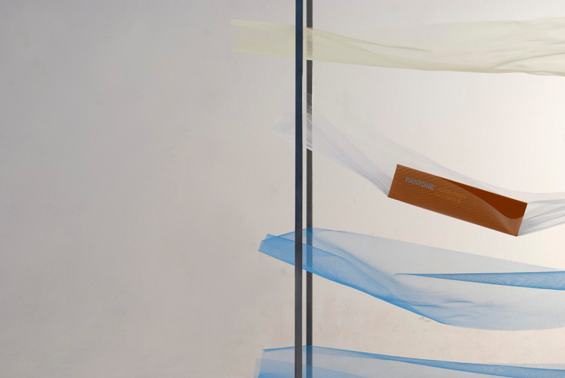 mizuki odashiro fastens pieces of colored tulle in the tone shelf 