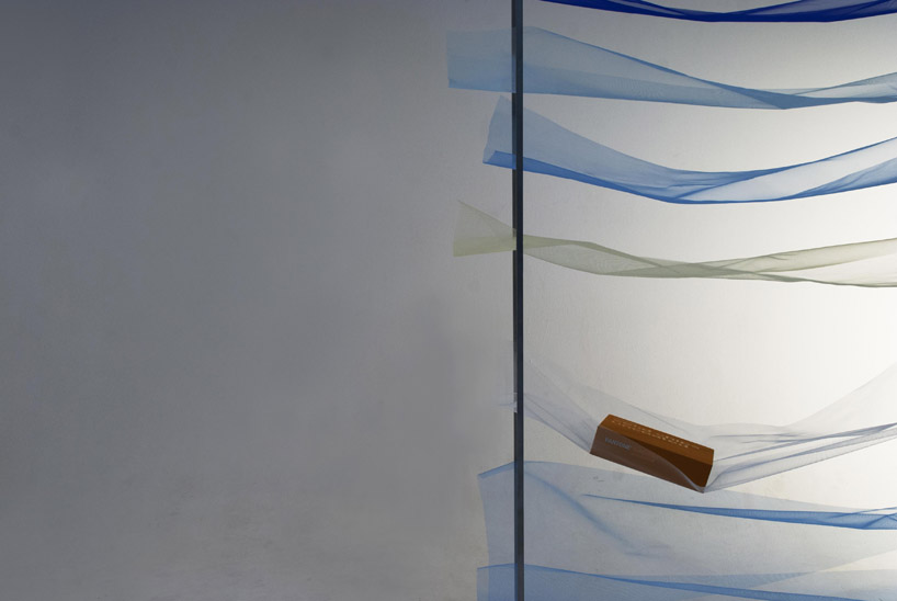 mizuki odashiro fastens pieces of colored tulle in the tone shelf 