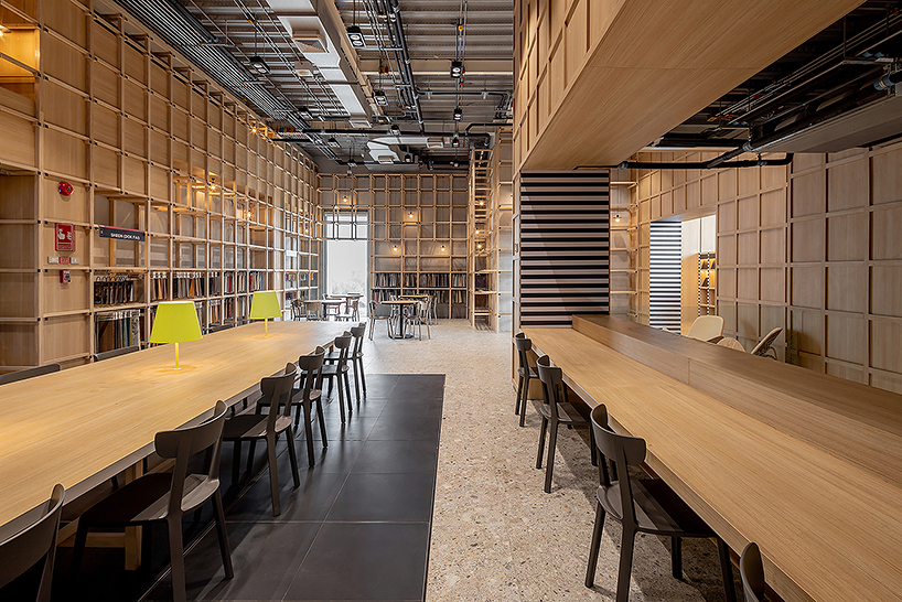 Onion's solid ash and plywood restaurant interior in Bangkok