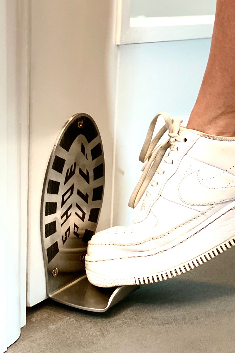 shoe pull is foot operated door handle that leaves your hands clean and free designboom