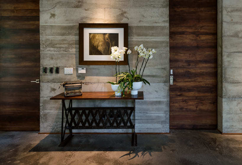 paz arquitectura's exposed concrete house in guatemala contrasts with surrounding woods