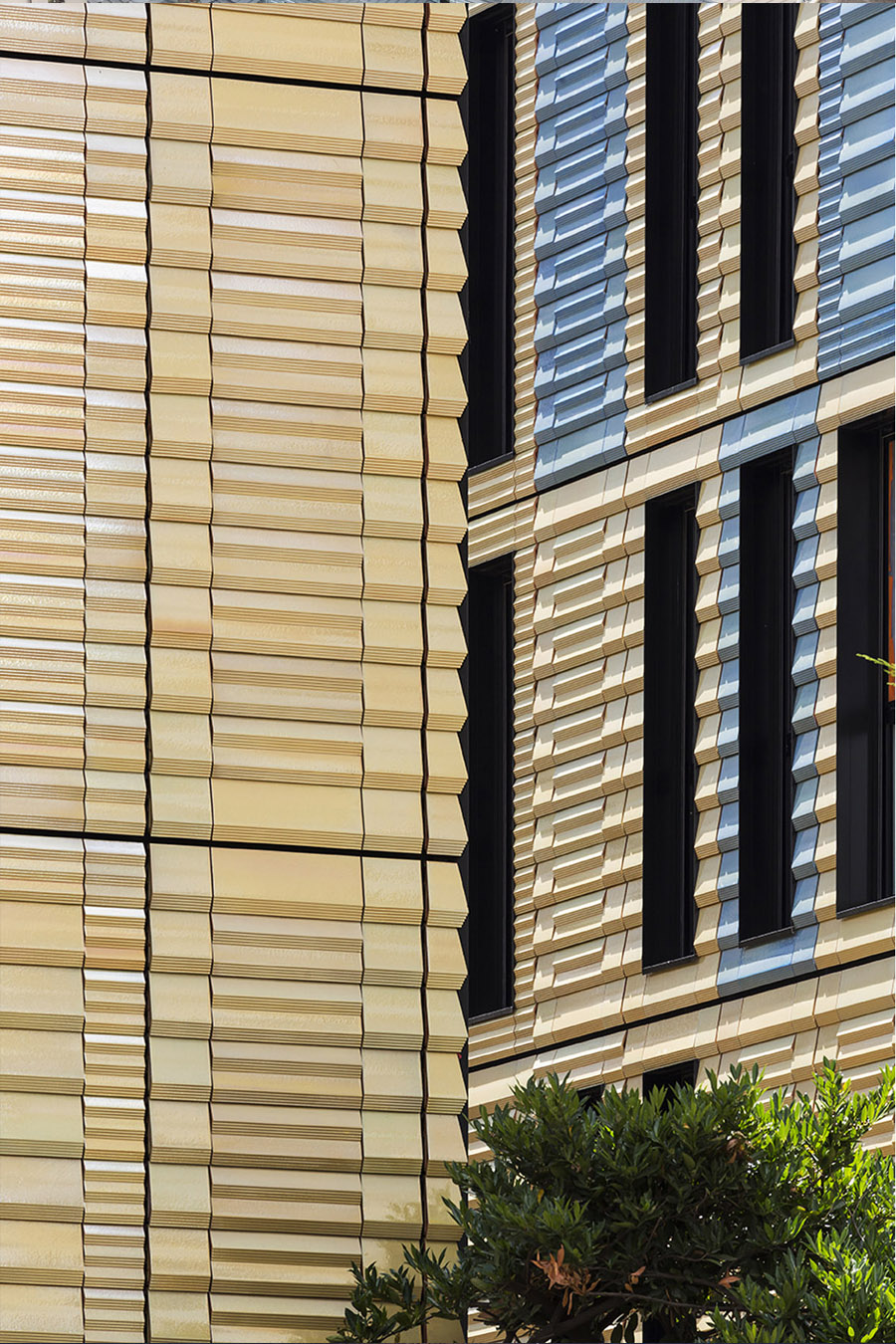 terracotta-clad social housing and restaurant in paris by PERIPHERIQUES