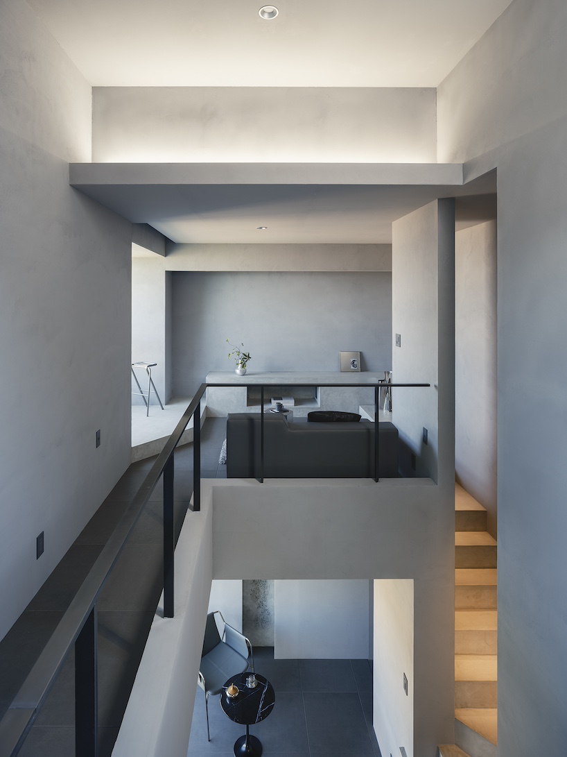 glazed passage frames lake views through this compact japanese house - 10