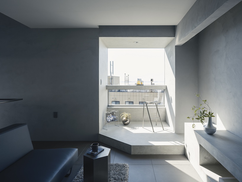 glazed passage frames lake views through this compact japanese house - 11