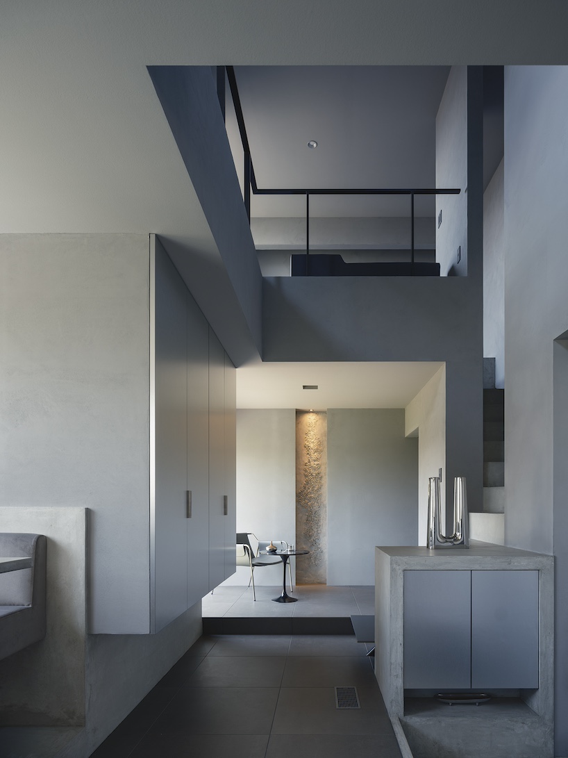 glazed passage frames lake views through this compact japanese house - 3