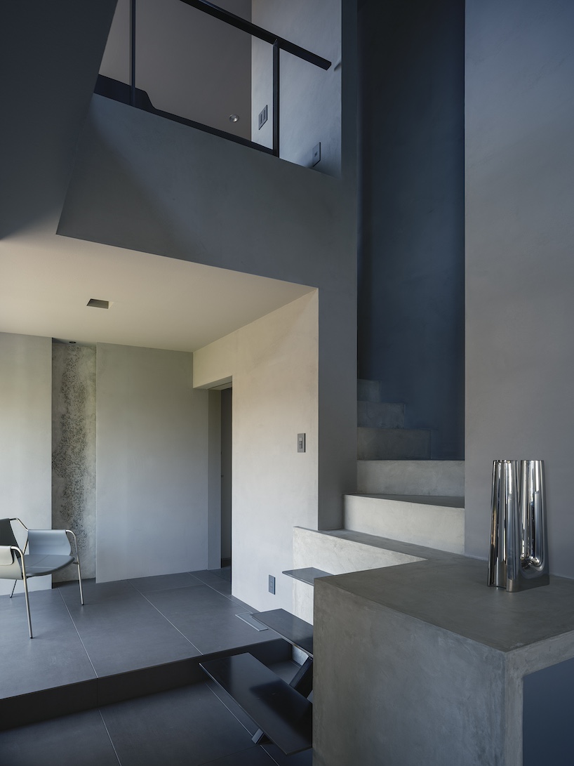 glazed passage frames lake views through this compact japanese house - 4