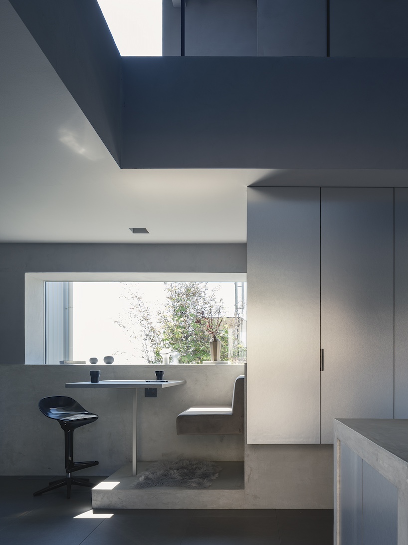 glazed passage frames lake views through this compact japanese house - 5