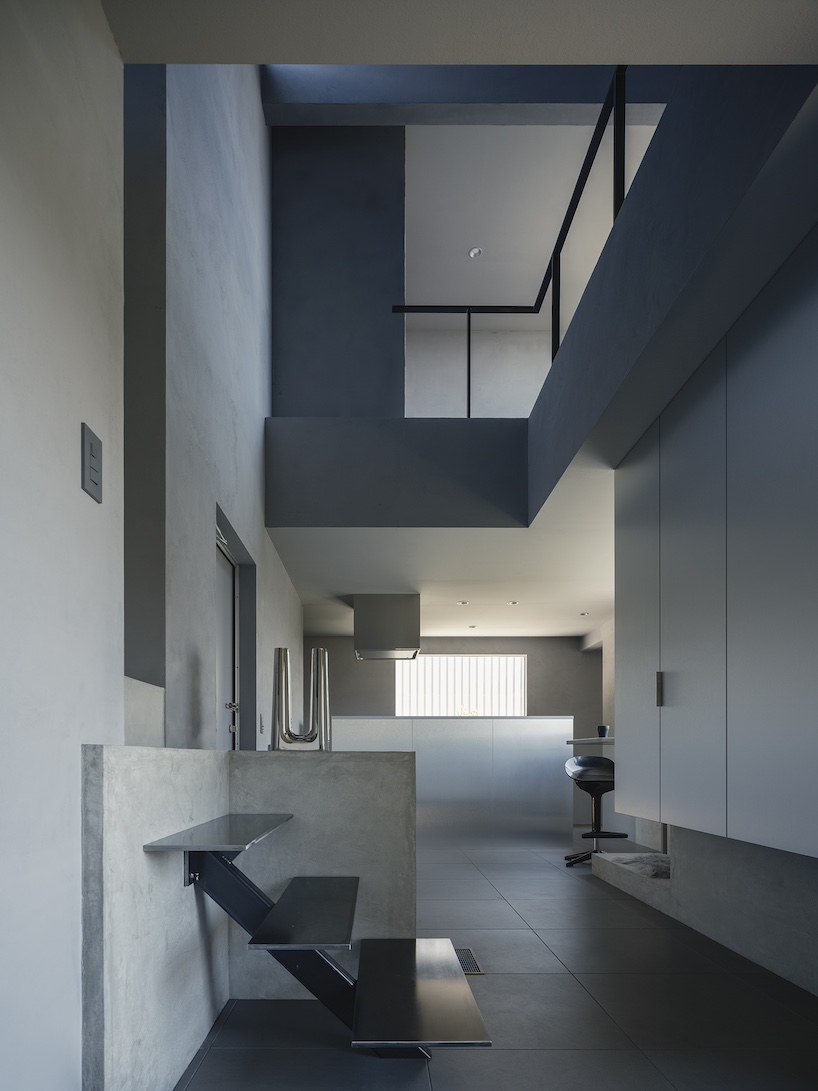 glazed passage frames lake views through this compact japanese house - 7