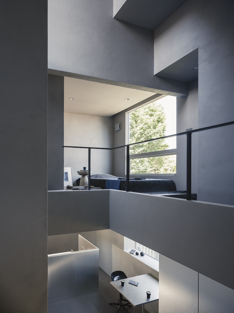 glazed passage frames lake views through this compact japanese house - 8