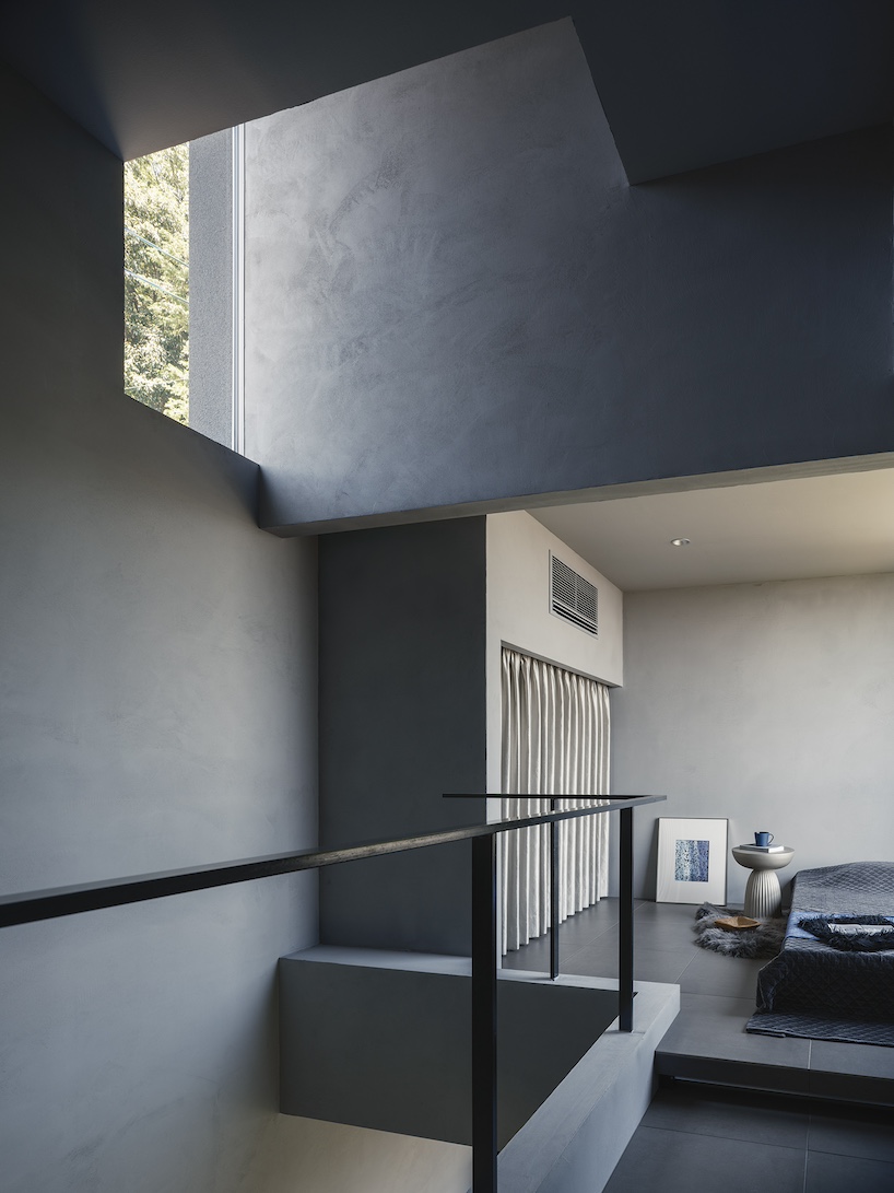 glazed passage frames lake views through this compact japanese house - 9