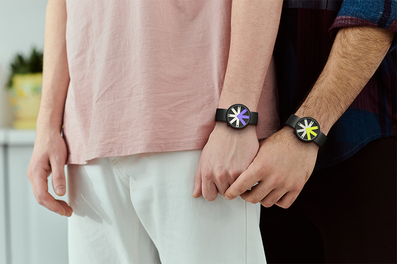 colored arrow dial rotates over eight transparent dividers in ion lucin's arrowatch