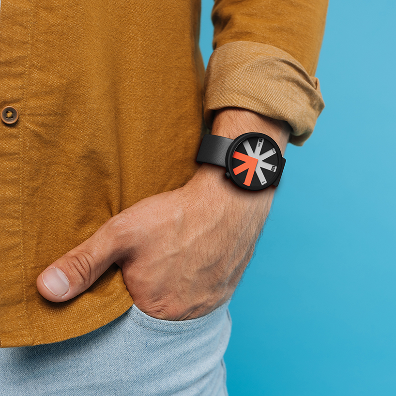 colored arrow dial rotates over eight transparent dividers in ion lucin's arrowatch