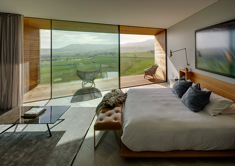 australian beach house creates farmland sanctuary from wild ocean surroundings