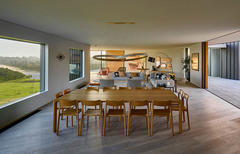 australian beach house creates farmland sanctuary from wild ocean surroundings