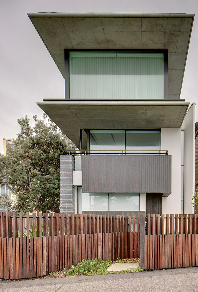 curved concrete and glass panels form residence in manly beach, australia