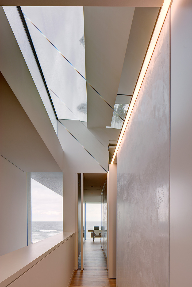 curved concrete and glass panels form residence in manly beach, australia