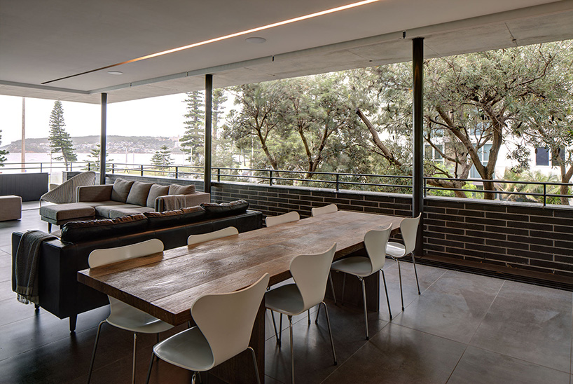 curved concrete and glass panels form residence in manly beach, australia