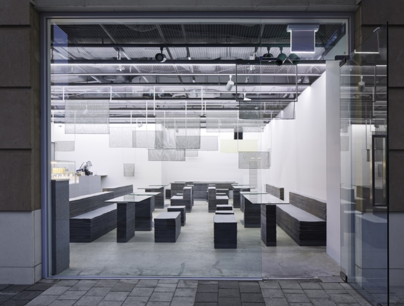 nameless architecture's stacked felt furniture creates a soft + solid café interior