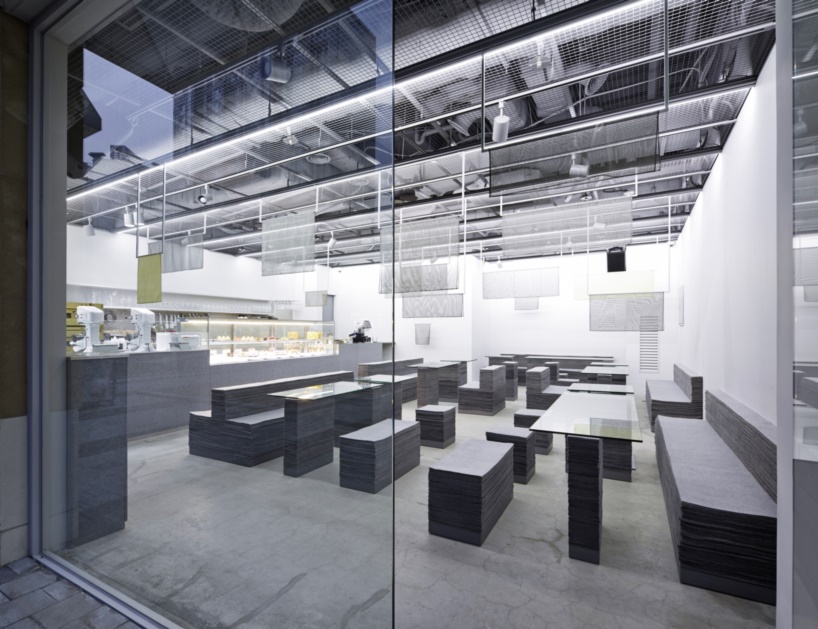 nameless architecture's stacked felt furniture creates a soft + solid café interior