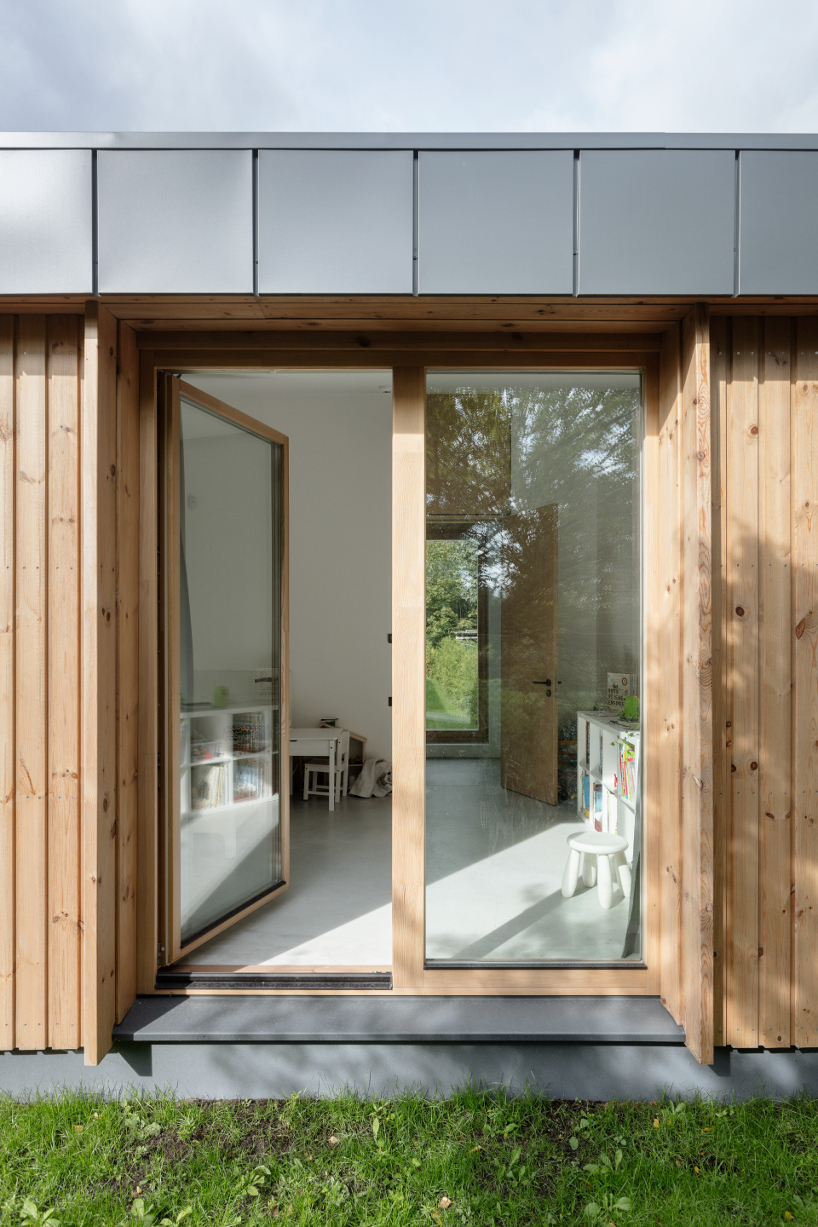gaiss interpret traditional pitch roof typology to fit a house in an l shaped plot 4