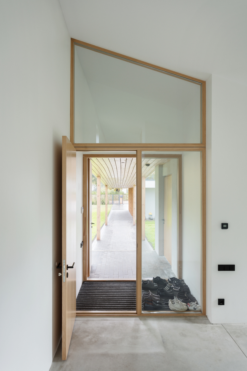 gaiss interpret traditional pitch roof typology to fit a house in an l shaped plot 5