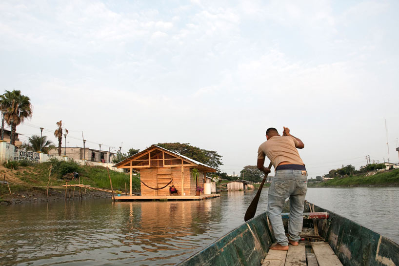 fisherman's refuge by natura futura + juan carlos bamba floats on a river in ecuador