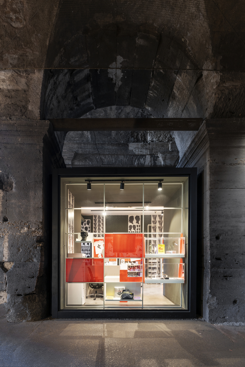 vibrant metal sheeting and patterned tapestries adorn bookstore by migliore+servetto in rome
