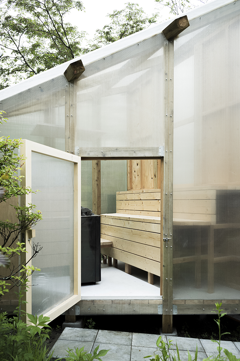 triangulated finnish sauna with ribbed polycarbonates is inspired by  japanese teahouse