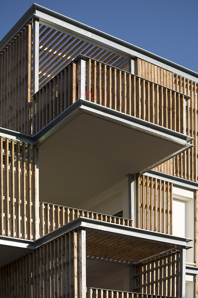 TLA architectes protrudes timber loggias from collective housing in france