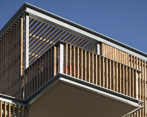 TLA architectes protrudes timber loggias from collective housing in france