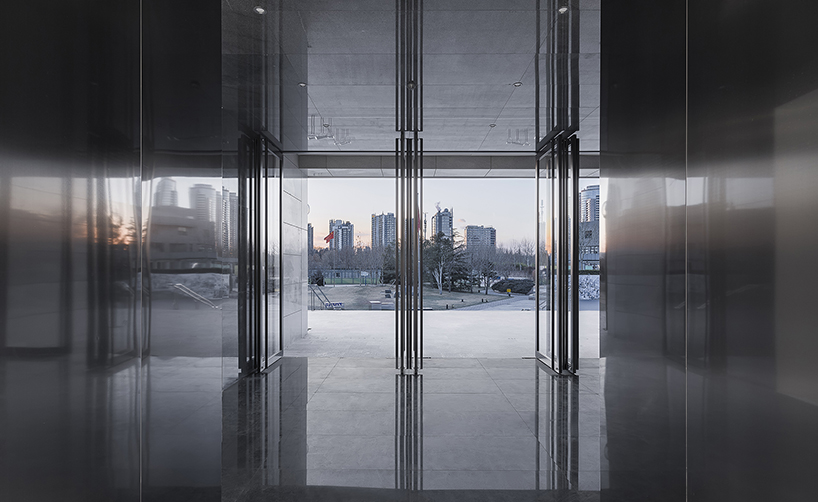 architecture school transforms old museum into a multifunctional futuristic space in beijing