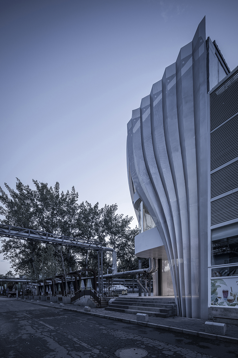 archstudio applies a metal curtain to clad IOMA art center in beijing