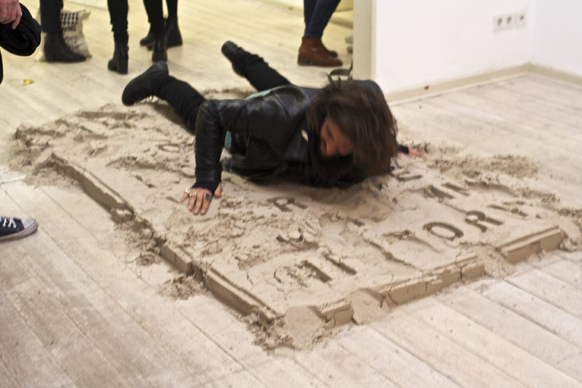 juan arata's participatory sand installation asks visitors to erase history