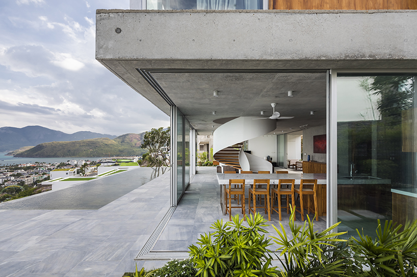 MM++ architects' villa in vietnam uses retractable glass loggia for unique ocean view