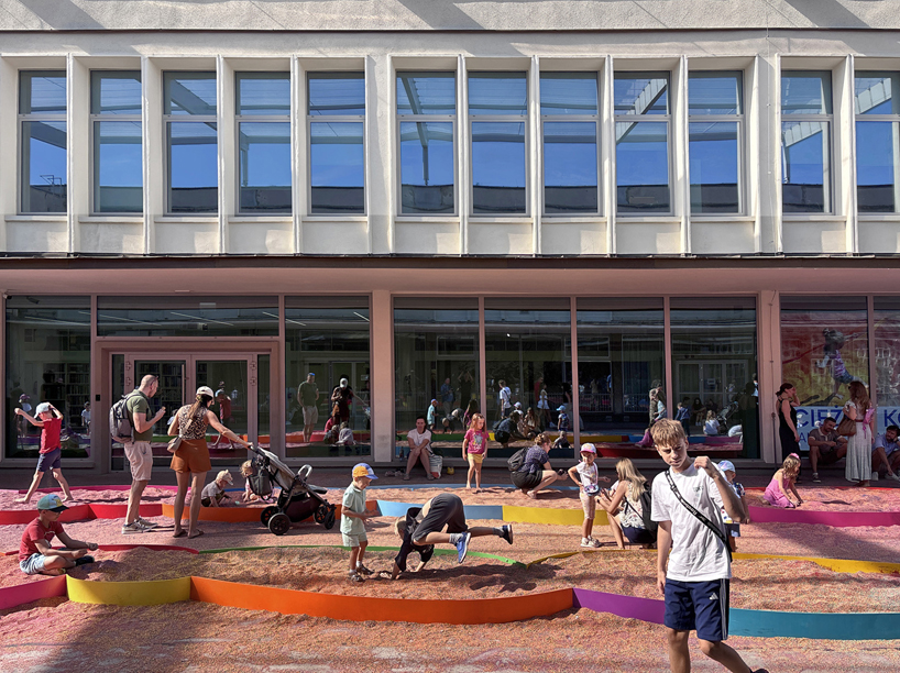 tons of colored aggregates mix together to form color path public art installation in poland