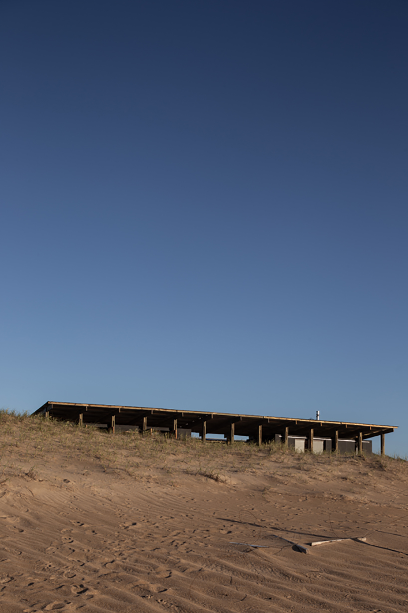 'punta rubia refuge' shielded by timber skeleton is settled along coastline in uruguay