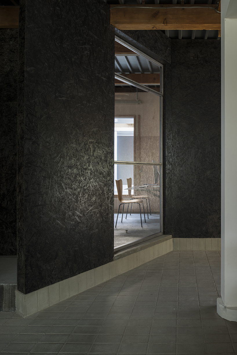 kosaku matsumoto reworks compact tokyo office interior with sliding doors and huge mirror