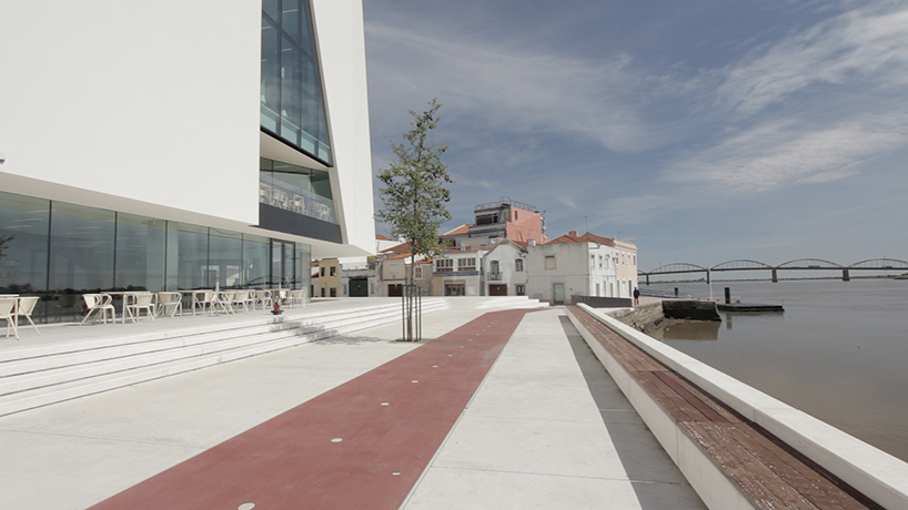 fabrica das palavras library connects city with waterfront in portugal