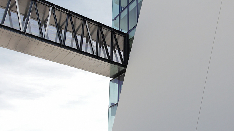 fabrica das palavras library connects city with waterfront in portugal