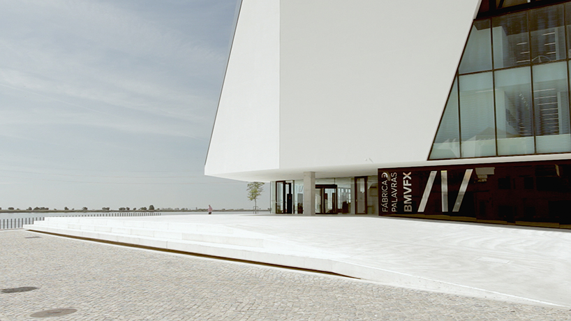 fabrica das palavras library connects city with waterfront in portugal