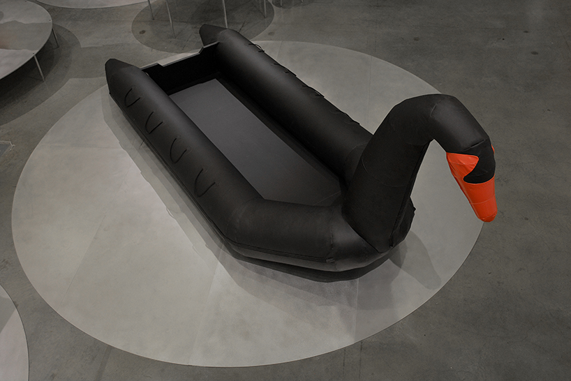 vacation vs immigration: designers fuse a refugee boat with an inflatable swan designboom