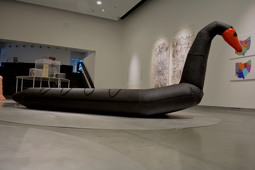 vacation vs immigration: designers fuse a refugee boat with an inflatable swan designboom