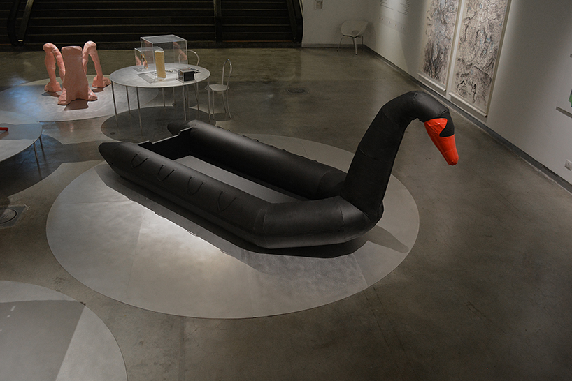 vacation vs immigration: designers fuse a refugee boat with an inflatable swan designboom