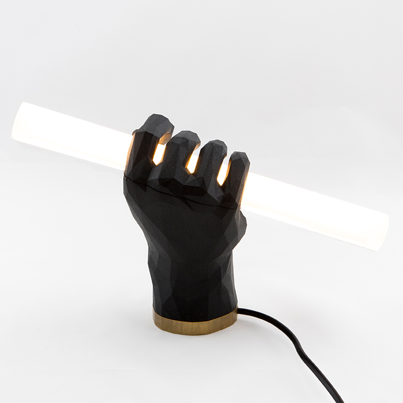 das happy medium puno fist lamp designboom