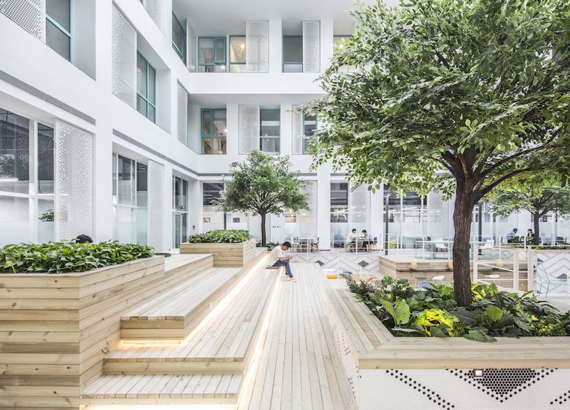 MAT office's beijing apartment complex and co-working space features a 16 meter-high atrium